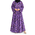 Wildstripe Abaya with a purple base, bold black abstract stripes, mustard accents, and a flowing full-length silhouette with front open