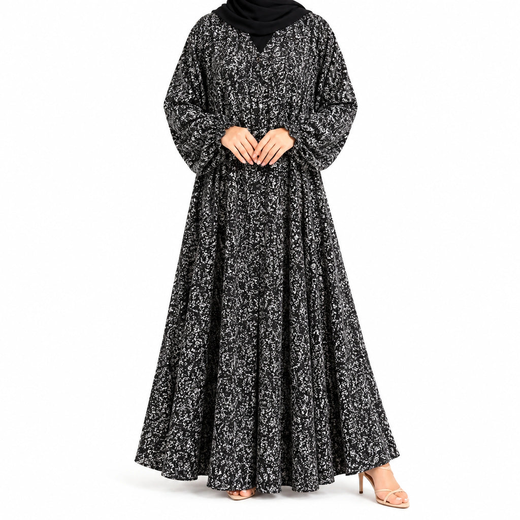 Stardust Print Abaya with a dark base, scattered white speckled pattern, and flowing full-length silhouette