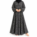 Stardust Print Abaya with a dark base, scattered white speckled pattern, and flowing full-length silhouette