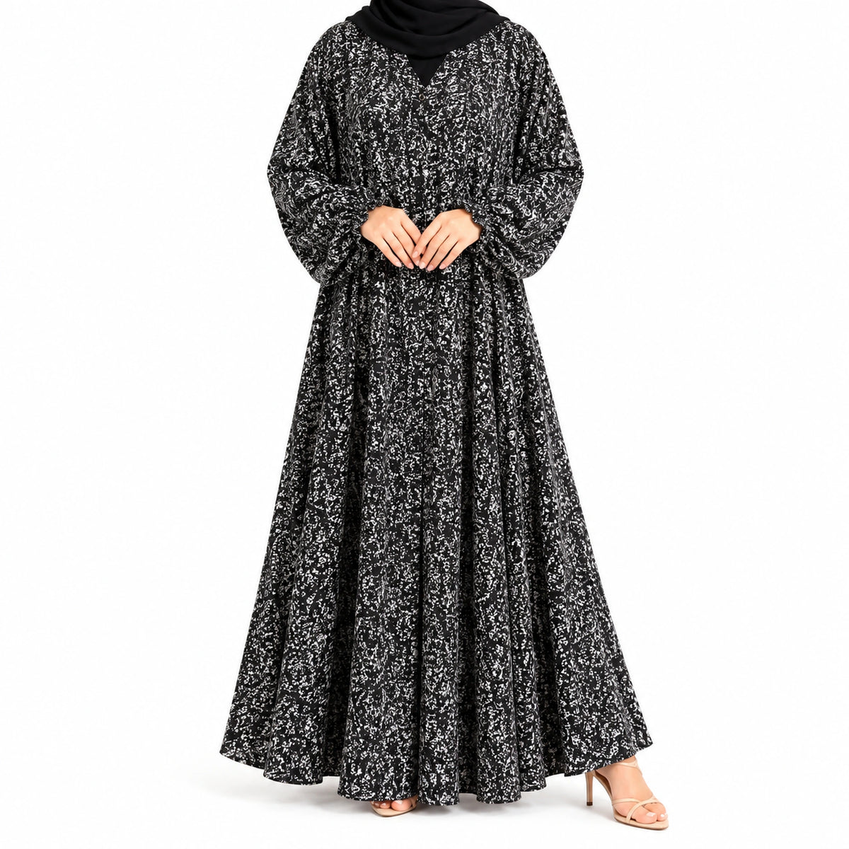 Stardust Print Abaya with a dark base, scattered white speckled pattern, and flowing full-length silhouette